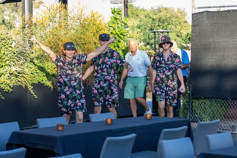 Golfers in matching aloha shirts