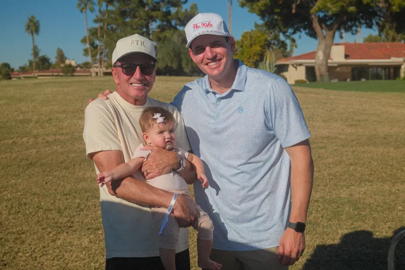A golfer and his daughter