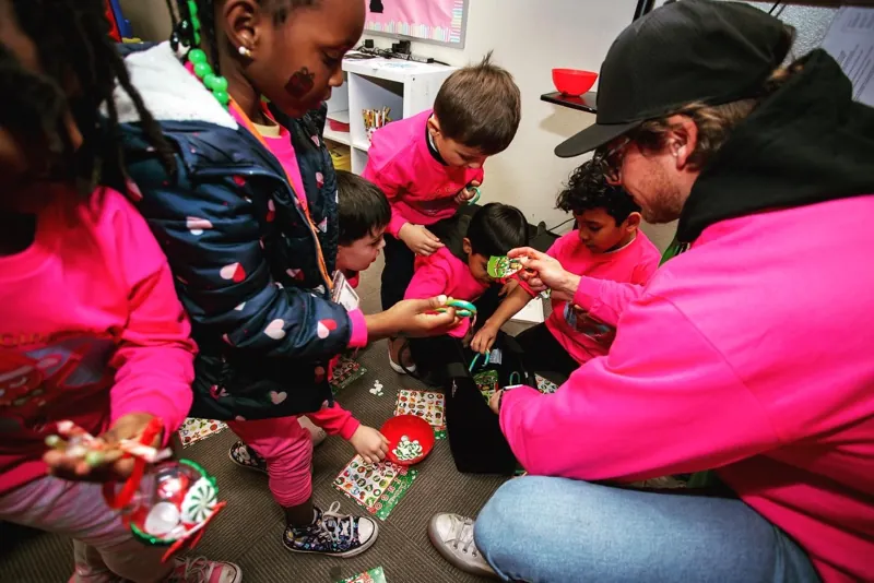 FTK volunteers handing out gifts to kids